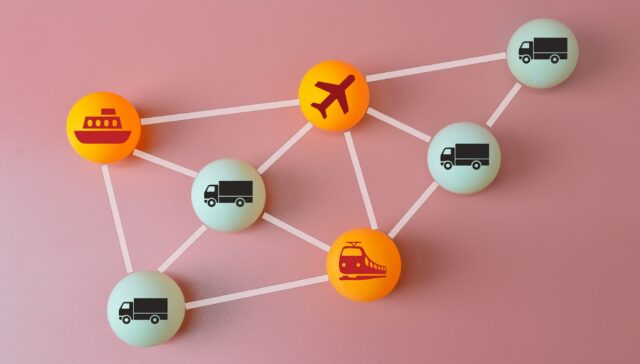 Connected logistics and supply chain concept. Table tennis ball with plane, trucks, train and ship s