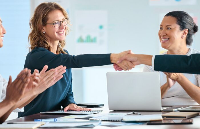 Deal handshake of business people in business meeting for trust, cooperation and collaboration. Wel