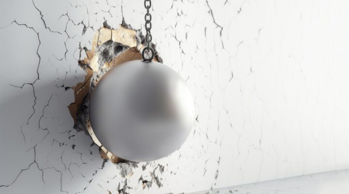 Metallic Wrecking Ball Shattering The White Wall